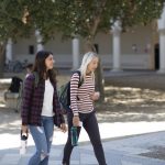 two students walking on campus