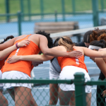 Tennis players in huddle