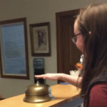 student ringing desk bell