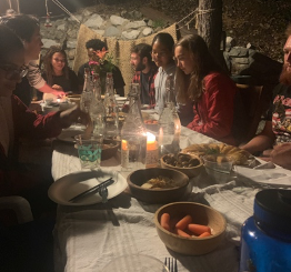 students having dinner at a professor's house