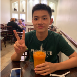 Kevin Hua drinking boba and holding up peace sign