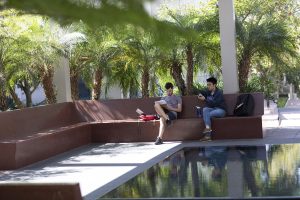 two students sitting on bench at SkySpace