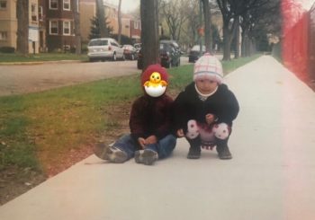 Sonam as small child with brother on sidewalk