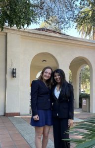 Vidushi and another member of Mock Trial posing outside