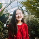 Emily Kim with plants in background