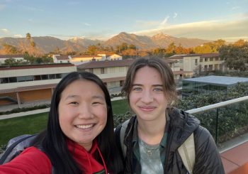 Emma and a friend on a rooftop with San Gabriel mountains backdrop