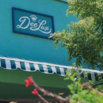image of DeeLux sign on building above canopy