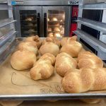 loaves of challah out of ovens