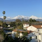 view of snow-capped mountains with Pomona building in foreground